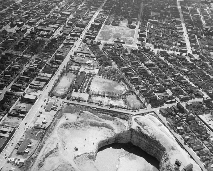 Aerial photograph of a quarry next to a residential area.
