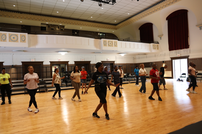 Photograph of a diverse group exercising.