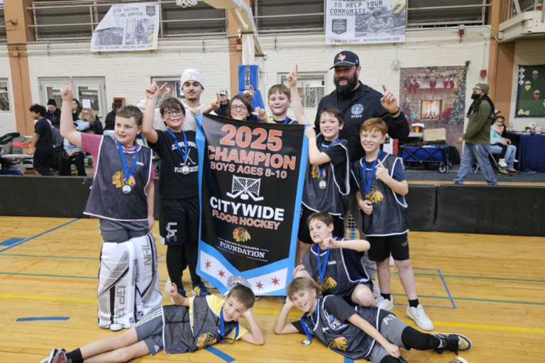 Floor hockey team celebrating championship, photograph.