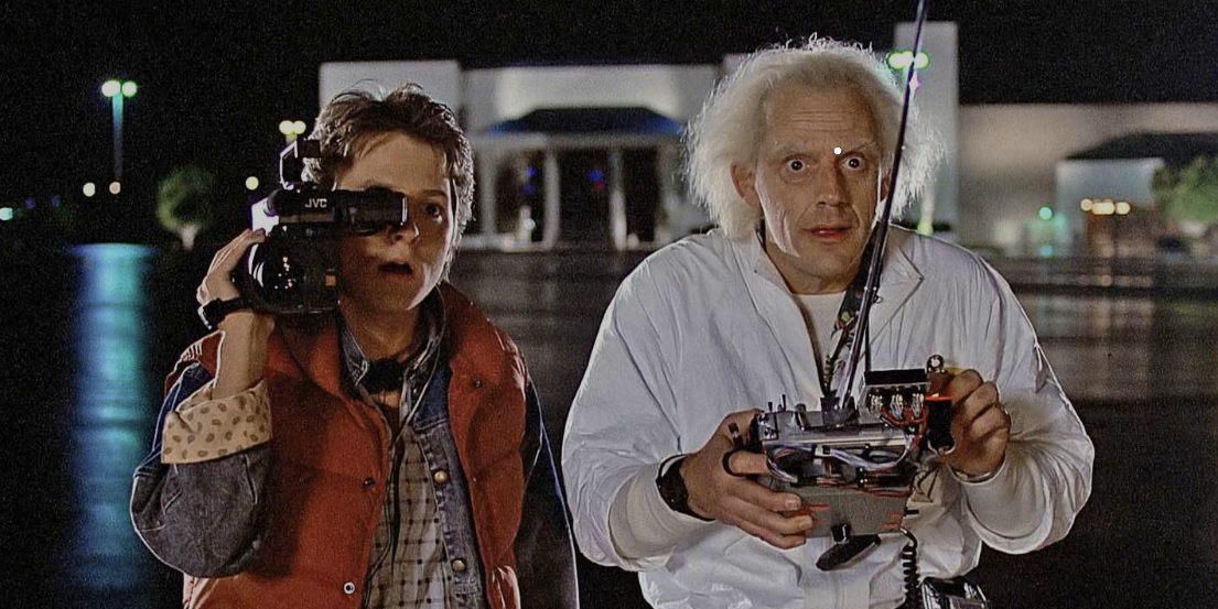 Marty McFly filming Doc Brown with a camcorder in a scene from Back to the Future.