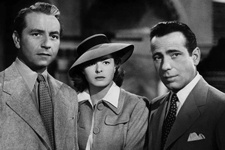 Black and white film still of Paul Henreid, Ingrid Bergman, and Humphrey Bogart.