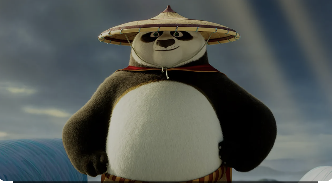 Po, the animated panda, wearing a straw conical hat and a red cape.