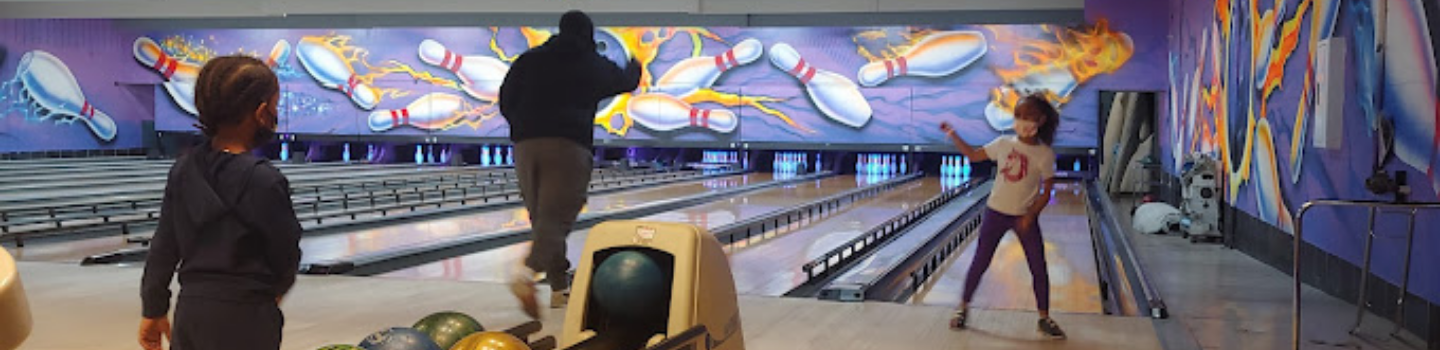 Bowling Alley.png Family bowling at a bowling alley.