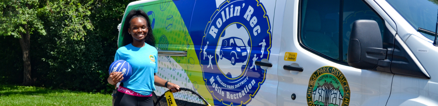 Smiling woman with basketball and Spikeball set beside 첥Ƶ "Rollin' Rec" van.