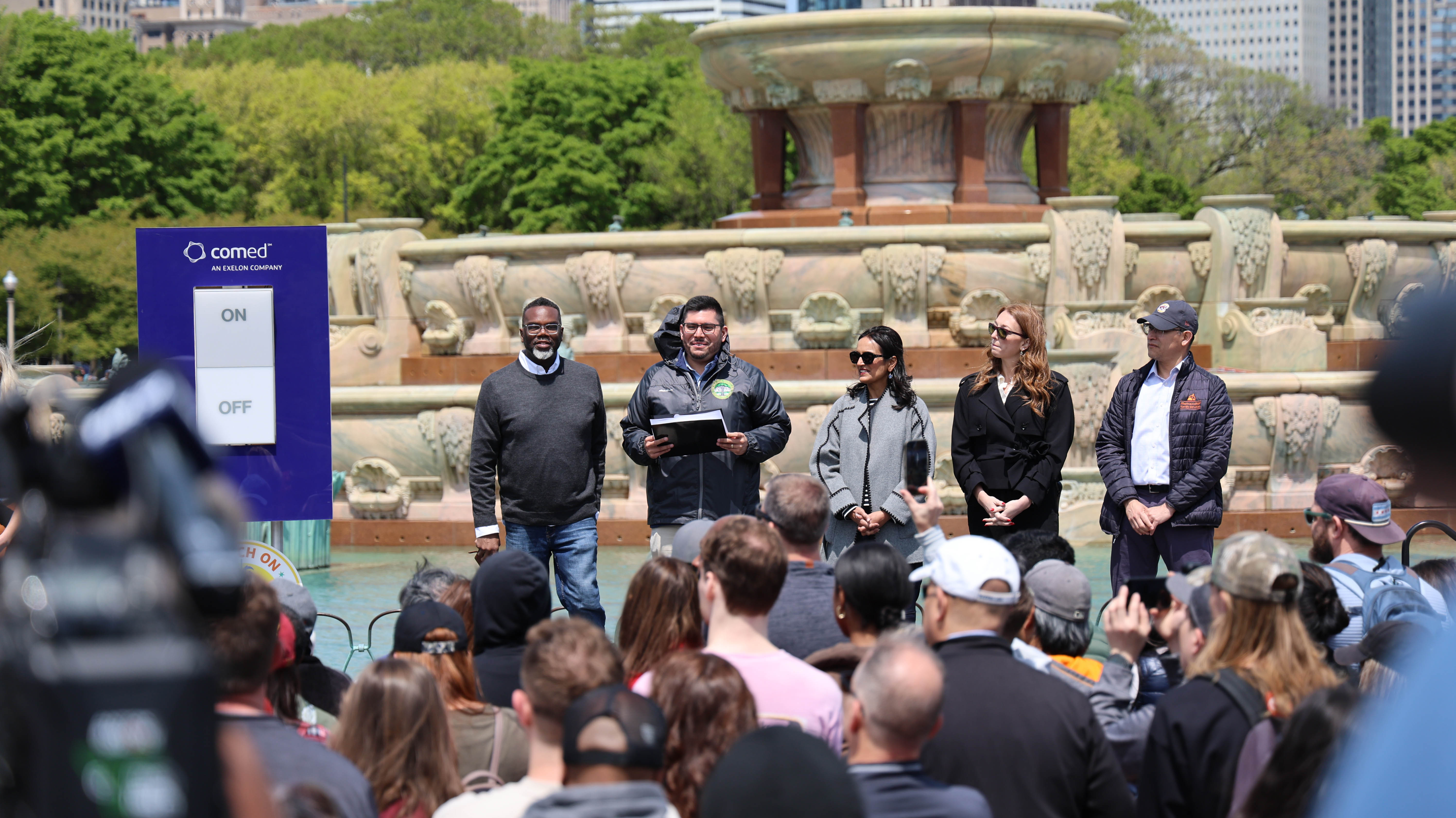 ComEd representatives speak at Buckingham Fountain's ceremonial "switching on" for the season.