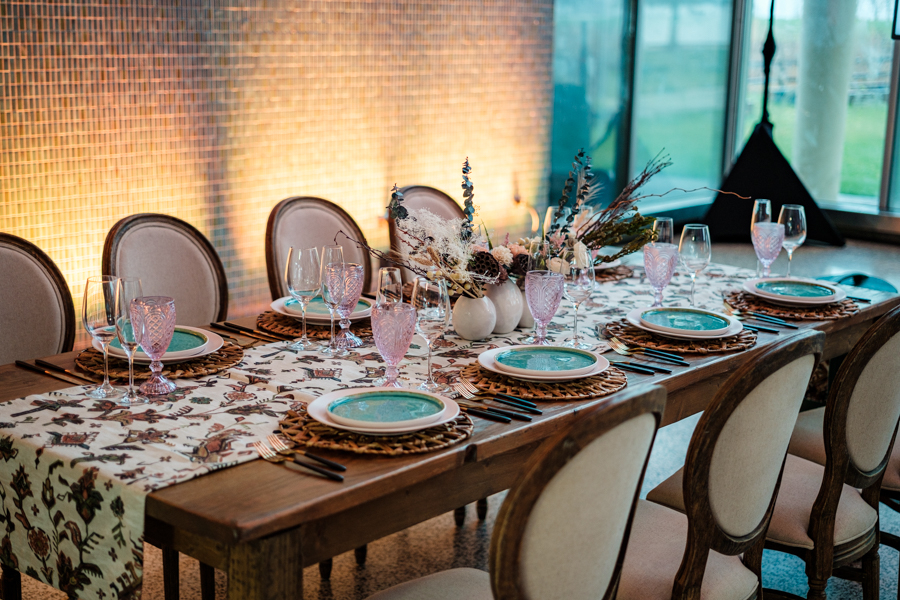 Boho style dining table set for a dinner party.
