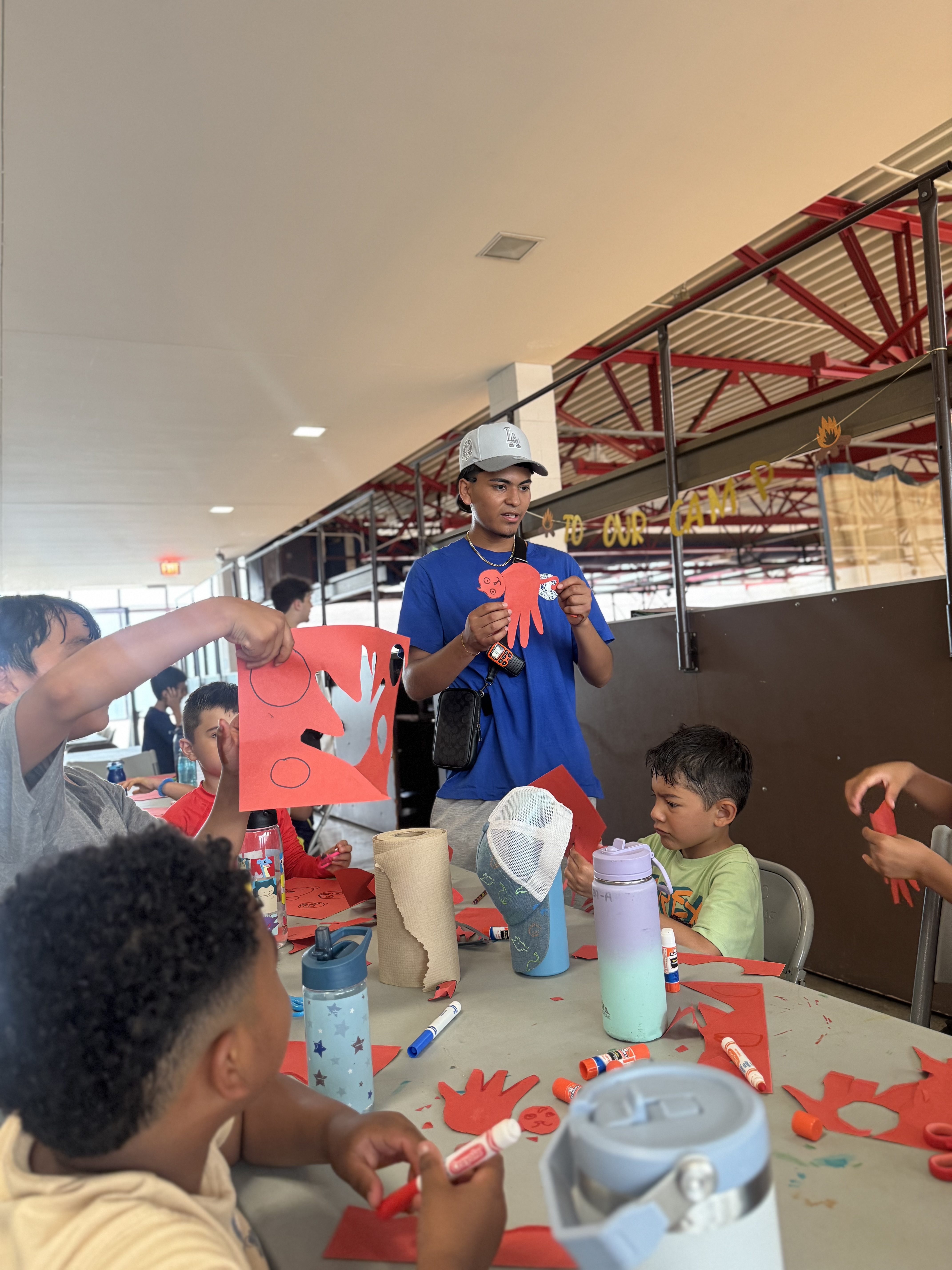 Children doing arts and crafts at a table.