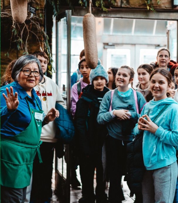 A volunteer guide leads students at the Garfield Park Conservatory.
