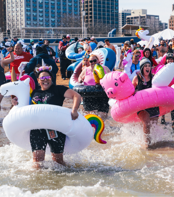People jumping in Lake Michigan in support the Polar Plunge in Chicago