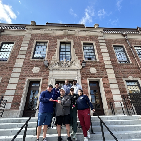 Group photo of staff in front of Jacob A. Riis bathhouse.